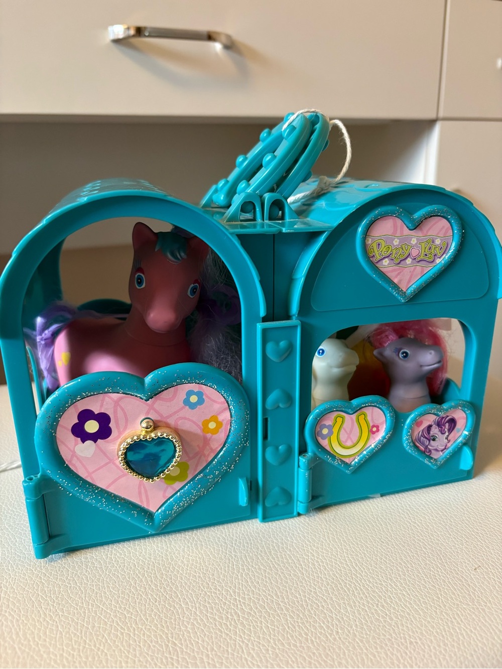 Teal Pony Play Carrier with Pink and Purple Pony Friends